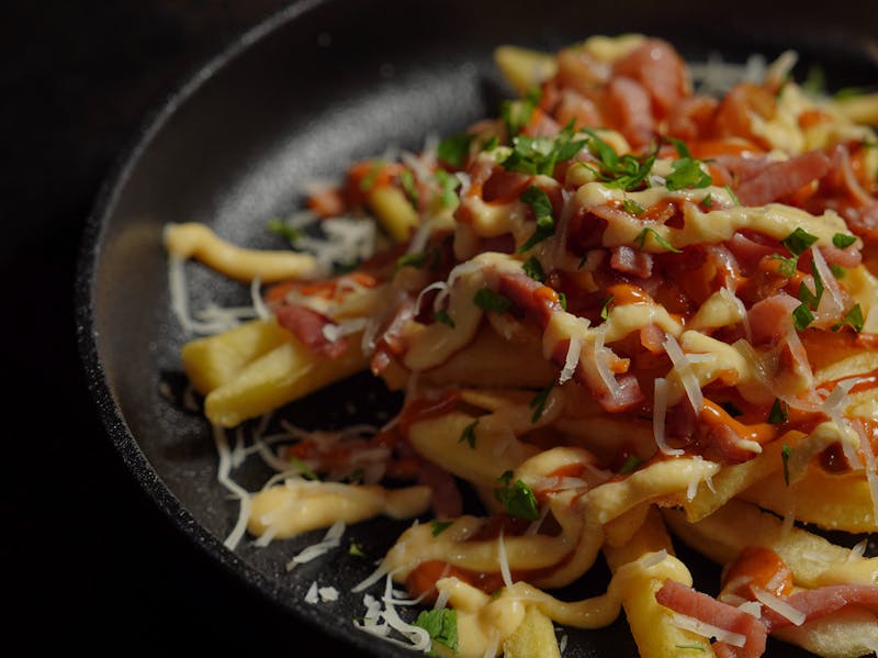 Loaded french fries with cheese and toppings side dish